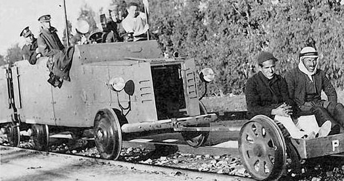 A British armored railroad wagon behind a railcar on which two Arab hostages are seated, 1936-1939 Arab Revolt