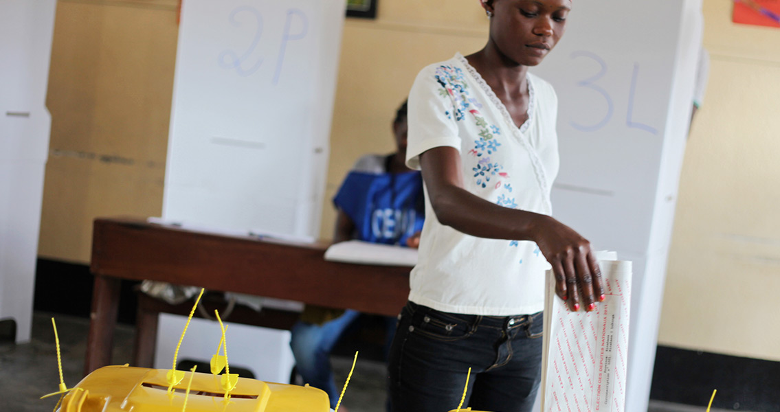 Woman voting with Ballot paper